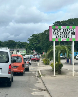 Vanuatu one month on: aftershocks, a no-go zone and anxiety A local business sign in Port Vila reads “Stay strong and carry on Vanuatu”