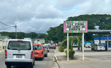 A local business sign in Port Vila reads “Stay strong and carry on Vanuatu”