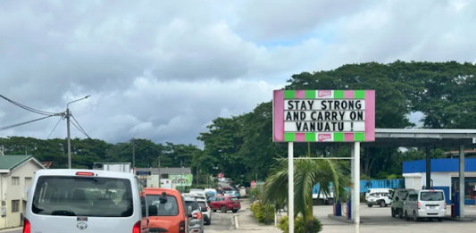 A local business sign in Port Vila reads “Stay strong and carry on Vanuatu”