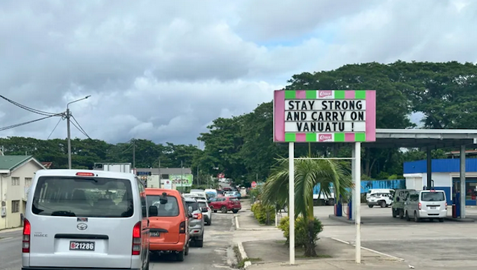 A local business sign in Port Vila reads “Stay strong and carry on Vanuatu”