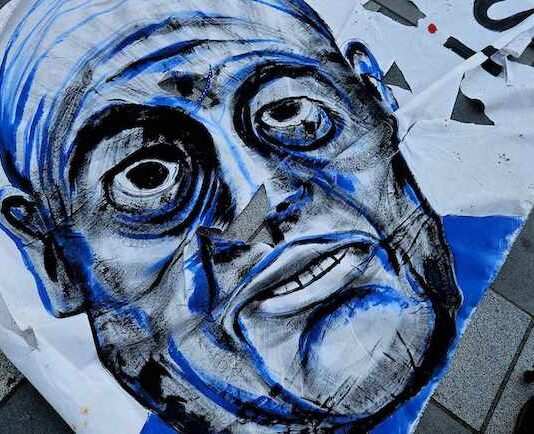 Israeli Prime Minister Benjamin Netanyahu as portrayed on a protest banner in New Zealand's largest city Auckland yesterday