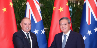 Chinese Premier Li Qiang meets with Cook Islands Prime Minister Mark Brown (left) in Harbin