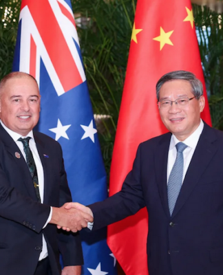 Chinese Premier Li Qiang meets with Cook Islands Prime Minister Mark Brown (left) in Harbin