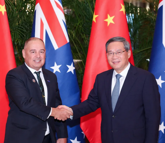 Chinese Premier Li Qiang meets with Cook Islands Prime Minister Mark Brown (left) in Harbin