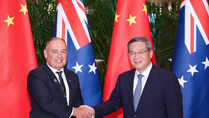 Chinese Premier Li Qiang meets with Cook Islands Prime Minister Mark Brown (left) in Harbin