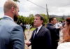 French Overseas Minister Manuel Valls (centre) clashes