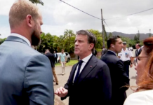 French Overseas Minister Manuel Valls (centre) clashes