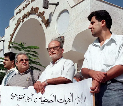 A group of Palestinian journalists protest in front of the Palestinian Legislative Council 