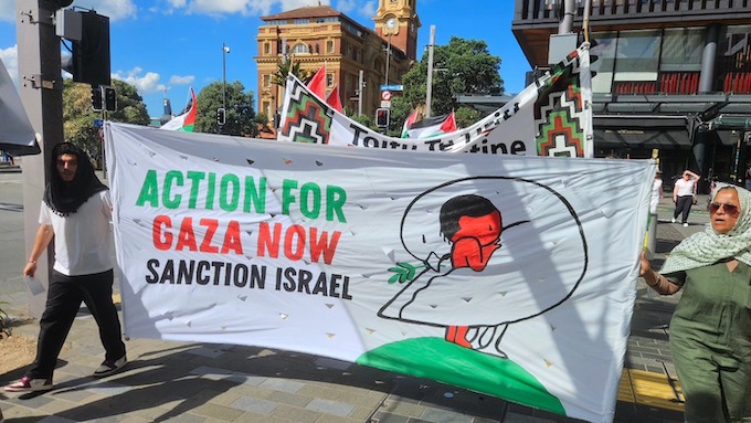 "Action for Gaza Now" banner heads a march protesting against Israel's resumed attacks