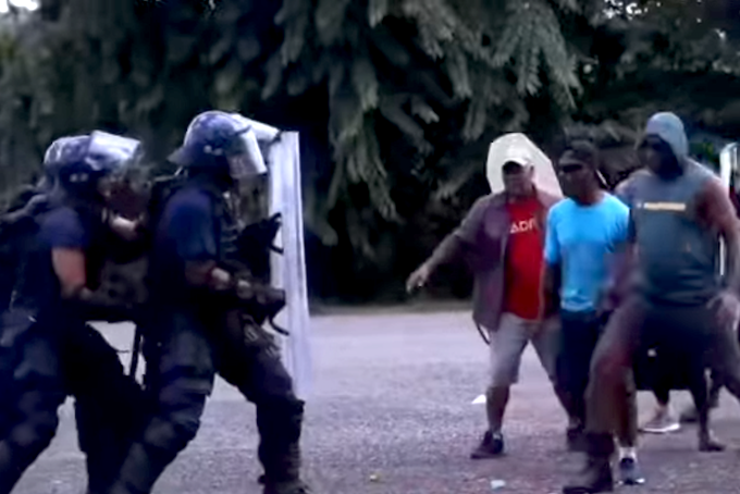 Fiji police confront protesters during the Operation Genesis exercise in Fiji