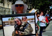 An Israeli soldiers "not welcome" placard at the Palestine solidarity rally and march in the heart of New Zealand's largest city Auckland today