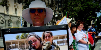 An Israeli soldiers "not welcome" placard at the Palestine solidarity rally and march in the heart of New Zealand's largest city Auckland today