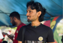 A Fijians for Palestine supporter shows off his "No embassy on occupied land" tee-shirt