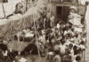 This photograph shows Rongelap Islanders on board the Greenpeace flagship Rainbow Warrior travelling to their new home on Mejatto Island in 1985