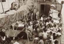 This photograph shows Rongelap Islanders on board the Greenpeace flagship Rainbow Warrior travelling to their new home on Mejatto Island in 1985