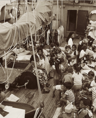 Rongelap Islanders on board the Greenpeace flagship Rainbow Warrior travelling to their new home on Mejatto Island in 1985