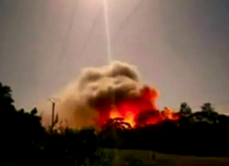 A sandalwood oil factory in flames on Maré Island