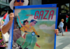 A New Zealand protester holds a poster for the "Trump Gaza" ethnic cleansing plan for a tourism development