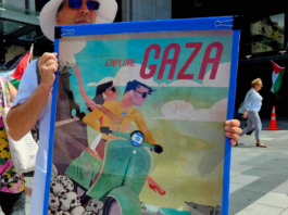 A New Zealand protester holds a poster for the "Trump Gaza" ethnic cleansing plan for a tourism development
