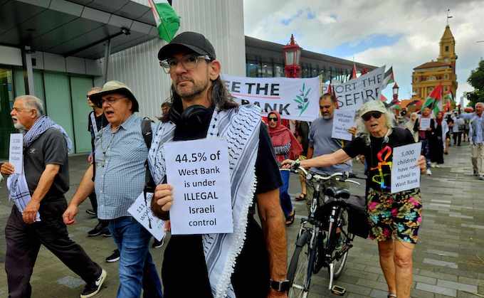 New Zealand protesters calling for the continuation of the Gaza ceasefire and for peace and justice in Palestine in a march along the Auckland waterfront 