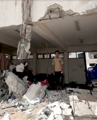 A school bombed out by Israeli forces provides some shelter to a family in Khan Younis, Gaza