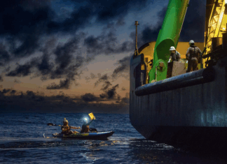 Greenpeace activists from around the world have paddled and protested around MV Coco, a specialised offshore drilling vessel