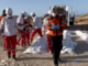 Red Crescent rescue workers recover bodies of the 15 Palestinian ambulance and first responder crews killed by Israeli forces