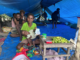 An evicted mother and baby selling betelnut in their temporary tent village on the outskirts of the capital, Port Moresby