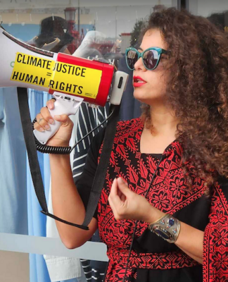 Palestinian singer and creative visualiser Rana Hamida speaking at the vigil on Easter Saturday