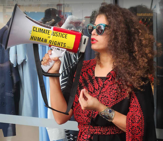 Palestinian singer and creative visualiser Rana Hamida speaking at the vigil on Easter Saturday