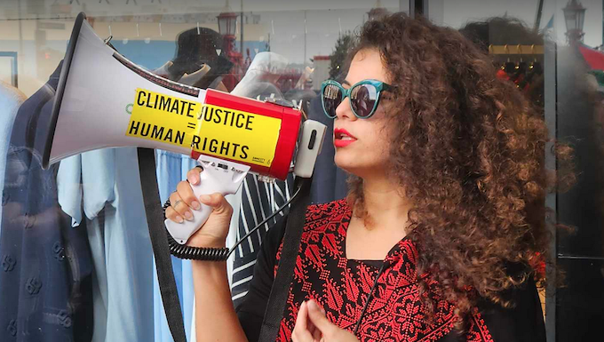 Palestinian singer and creative visualiser Rana Hamida speaking at the vigil on Easter Saturday