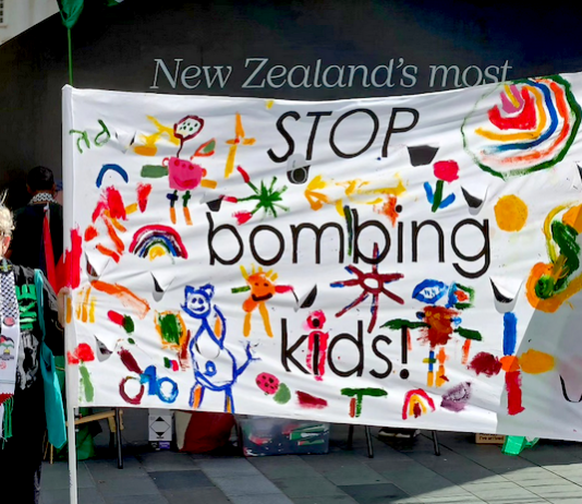 "Stop bombing kids" . . . a banner at the solidarity rally in Auckland's "Palestine Corner"