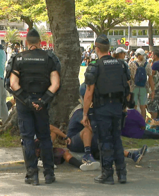 French gendarmes on guard at Noumea's central Place des Cocotiers