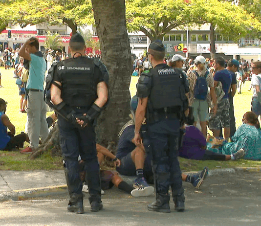 French gendarmes on guard at Noumea's central Place des Cocotiers