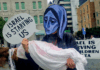 "Israel is starving us" in Gaza, says the protest placard in Auckland