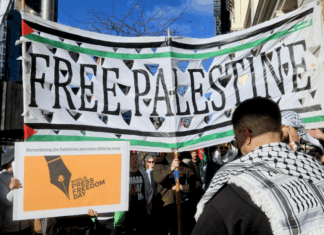 Protesters march to Television New Zealand headquarters on World Media Freedom Day