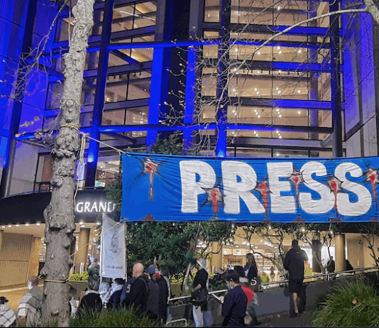 Pro-Palestine protesters outside the NZ Voyager Media Awards in Auckland tonight demonstrating against "biased" media coverage