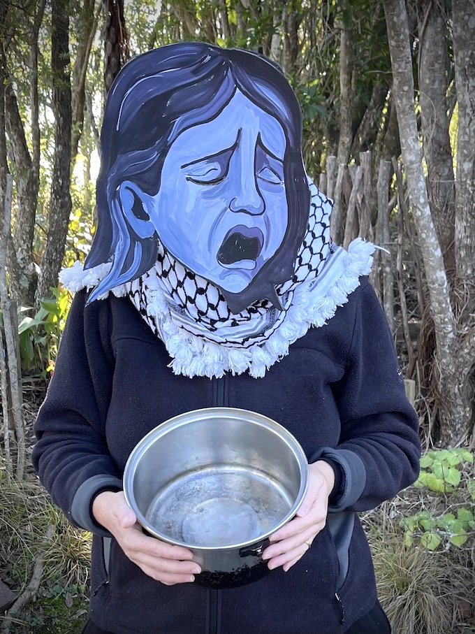 A street theatre protester demonstrates against starvation as a weapon of war as deployed by Israel in its brutal war on Gaza