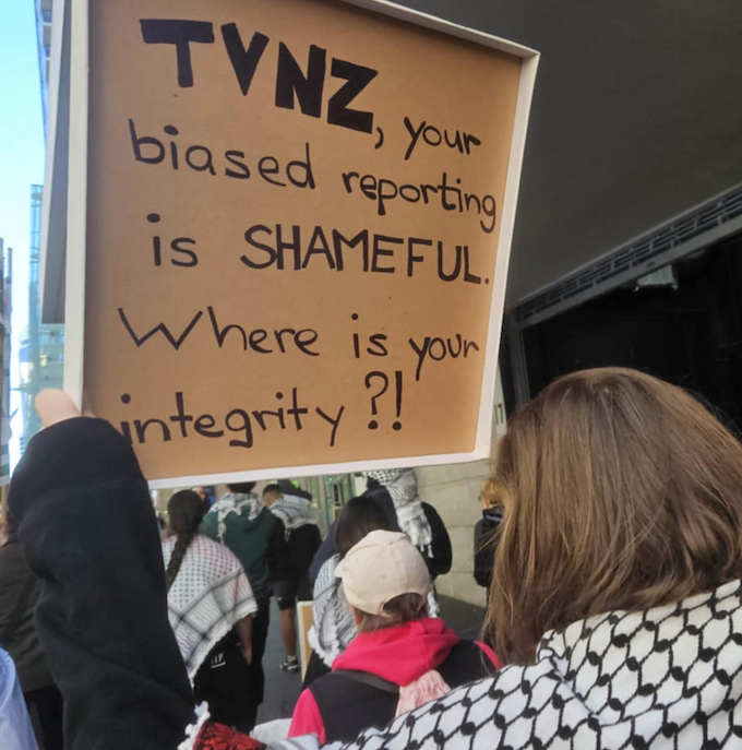 A protester placard declaring "TVNZ, you're biased reporting is shameful