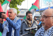 NZ Palestinian advocate Dr Adnan Ali (right) speaking at yesterday's Henderson peace rally
