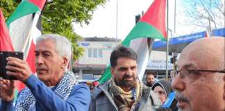 NZ Palestinian advocate Dr Adnan Ali (right) speaking at yesterday's Henderson peace rally