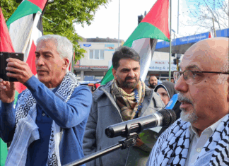 NZ Palestinian advocate Dr Adnan Ali (right) speaking at yesterday's Henderson peace rally
