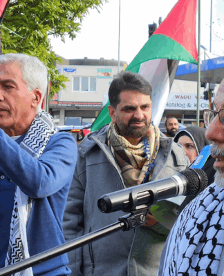 NZ Palestinian advocate Dr Adnan Ali (right) speaking at yesterday's Henderson peace rally