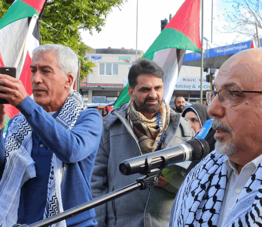 NZ Palestinian advocate Dr Adnan Ali (right) speaking at yesterday's Henderson peace rally