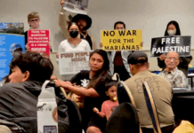 CNMI and Guam activists stage a rally protesting against the US military buildup in the Marianas