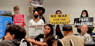 CNMI and Guam activists stage a rally protesting against the US military buildup in the Marianas