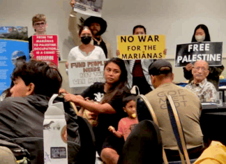CNMI and Guam activists stage a rally protesting against the US military buildup in the Marianas