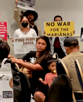 CNMI and Guam activists stage a rally protesting against the US military buildup in the Marianas