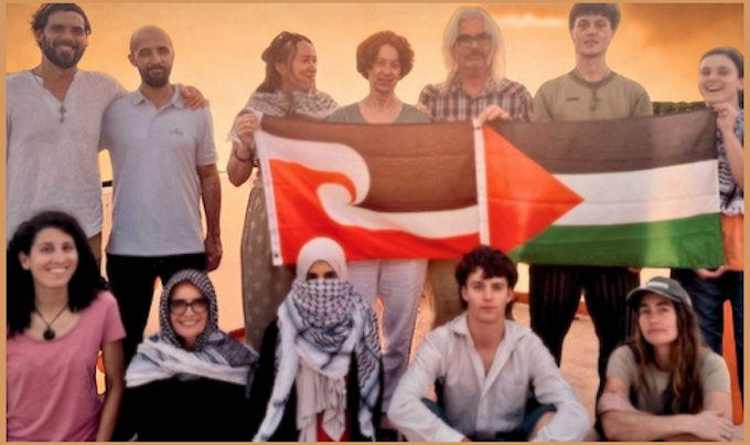 New Zealand and other activists with Tino Rangatiratanga and Palestine flags taking part in the Global March To Gaza