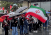 Iranian and Palestinian flags at a solidarity rally in Tāmaki Makaurau Auckland today